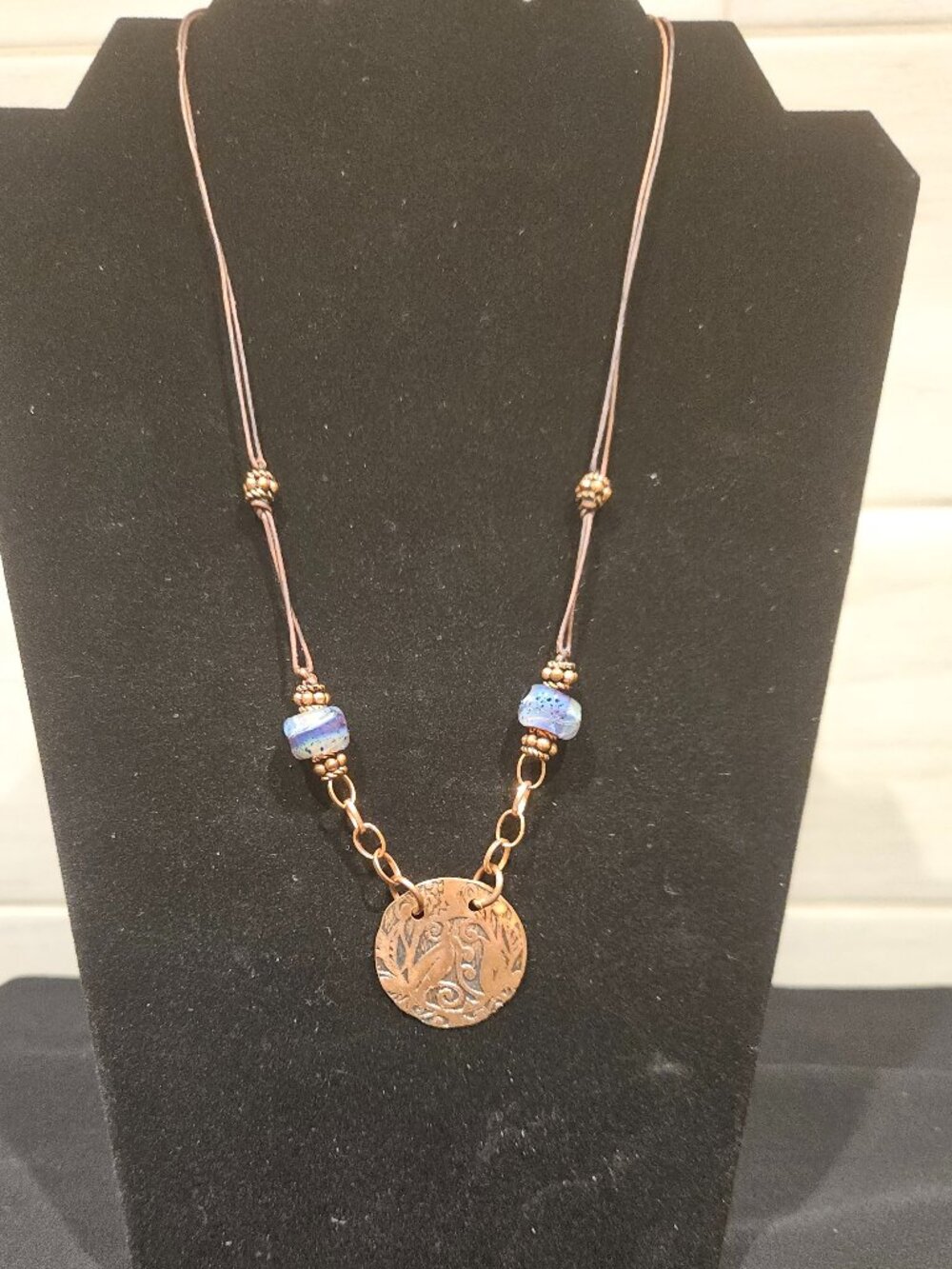 PENDANT, HANDMADE OF COPPER, LEATHER CORD AND GLASS BEADS